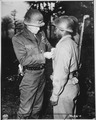 "Lt. Gen. George S. Patton, U.S. Third Army commander, pins the Silver Star on Private Ernest A. Jenkins of New York Cit - NARA - 535724.tif
